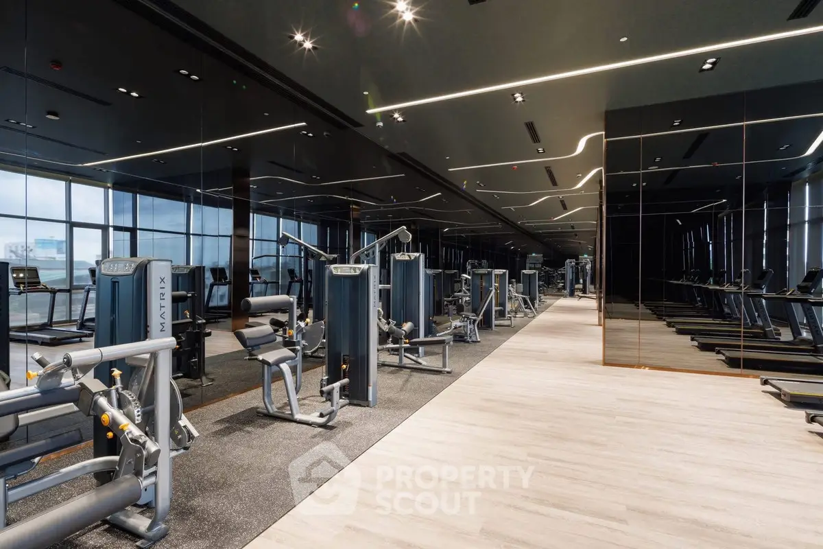 Luxurious modern gym with state-of-the-art fitness equipment and sleek design.