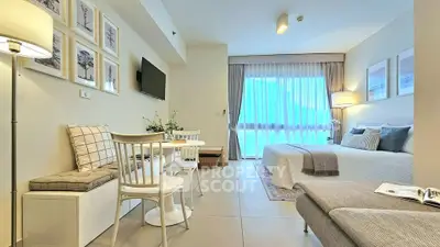Modern studio apartment with cozy living area and stylish decor