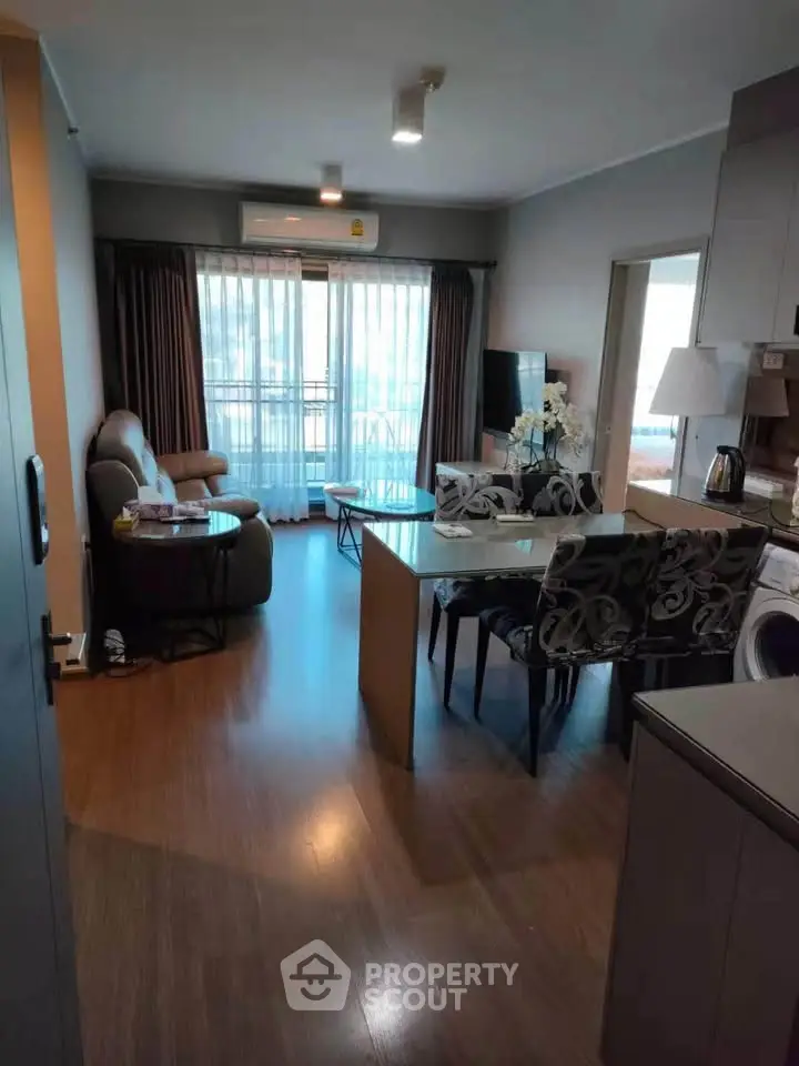 Modern living room with open kitchen and stylish decor