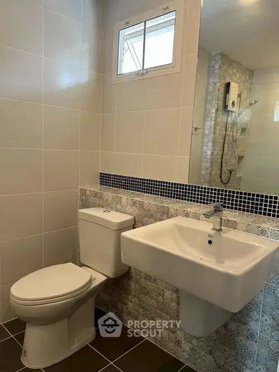 Modern bathroom with stylish tiles and sleek fixtures