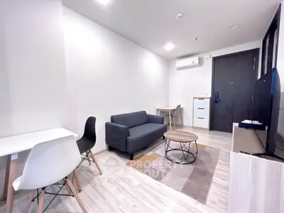 Modern living room with sleek furniture and neutral tones, perfect for urban living.