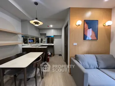 Modern open-plan living room with stylish dining area and cozy sofa