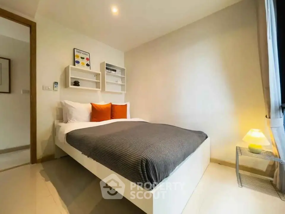 Cozy modern bedroom with stylish decor and natural light