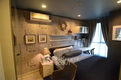 Cozy bedroom with modern decor and natural light, featuring stylish furniture and wall art.