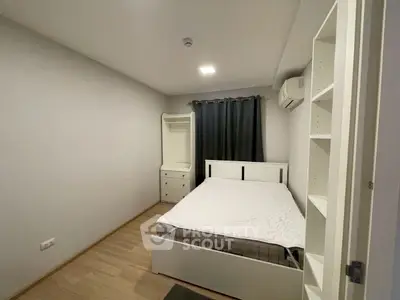 Cozy bedroom with modern furnishings and ample storage space