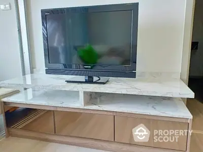 Modern living room with sleek TV stand and marble top