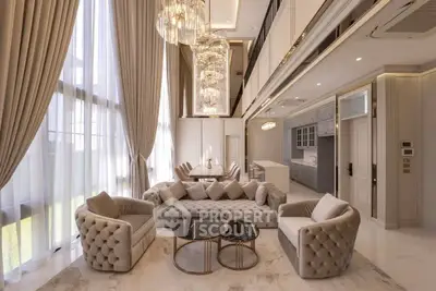 Luxurious double-height living room with elegant chandeliers and plush seating in a modern open layout.