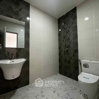 Modern bathroom with sleek fixtures and elegant tile design