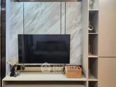 Modern living room with stylish TV setup and elegant shelving