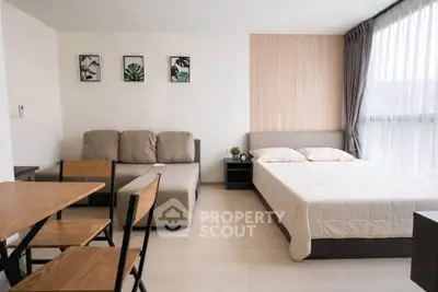 Modern studio apartment with cozy bed and stylish decor