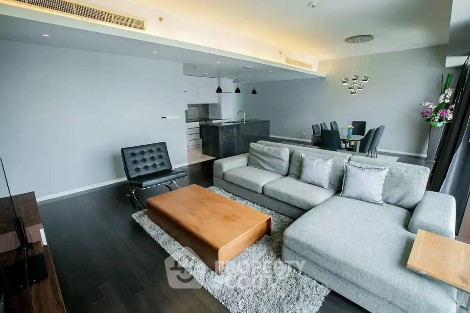 Spacious modern living room with open kitchen and elegant dining area