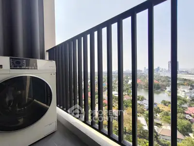 High-rise balcony with washing machine and stunning city view