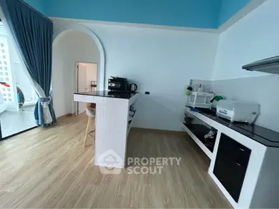 Modern kitchen with open layout and stylish breakfast bar in a bright apartment