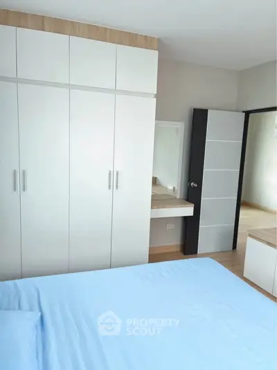Modern bedroom with built-in wardrobe and minimalist design