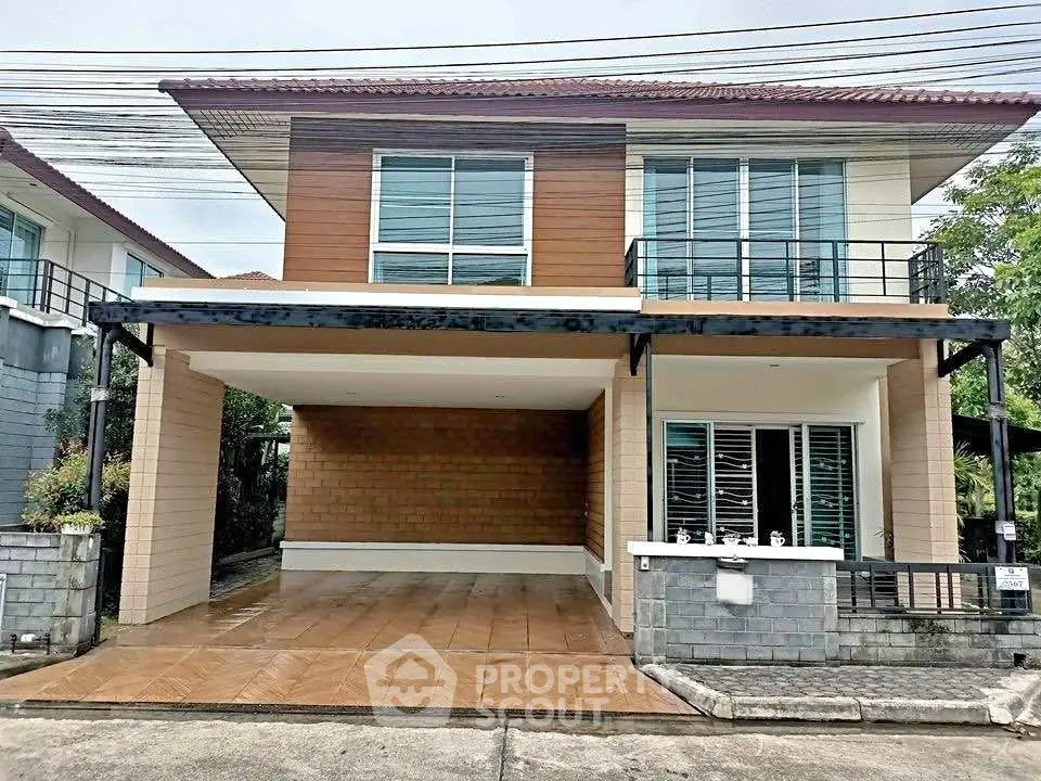 Modern two-story house with spacious carport and sleek design