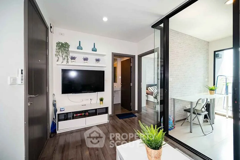 Modern living room with sleek decor and balcony access