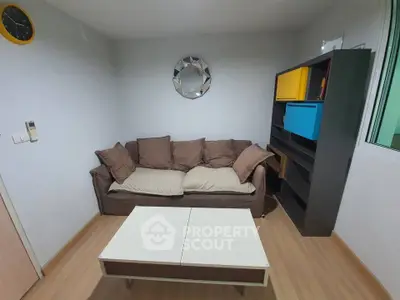 Cozy living room with modern decor and comfortable sofa in a stylish apartment.