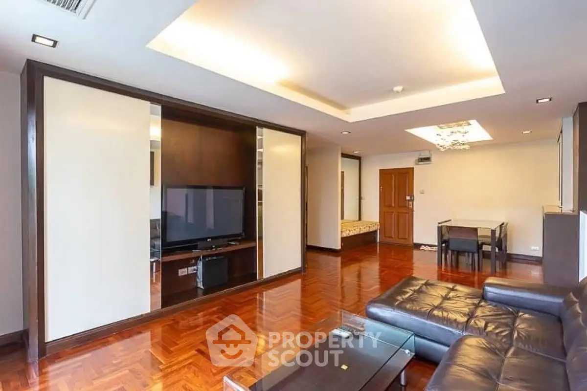 Spacious living room with modern design and elegant wooden flooring