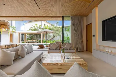 Luxurious living room with pool view and modern decor