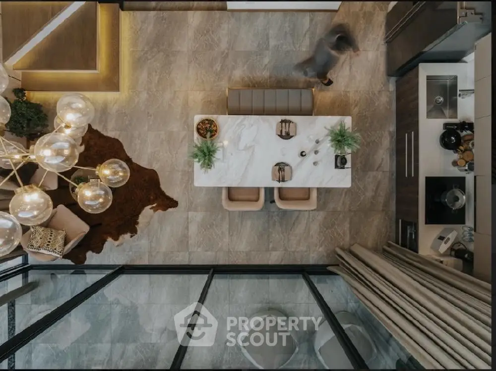 Luxurious modern kitchen with sleek design and elegant dining area, featuring open layout and stylish decor.