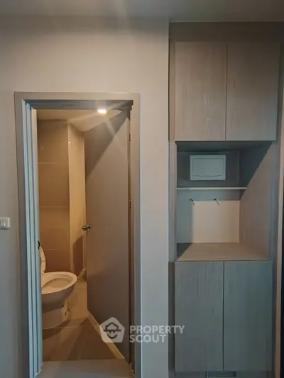 Modern bathroom with sleek cabinetry and neutral tones in a contemporary apartment.