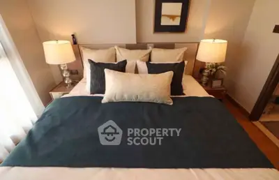 Cozy bedroom with elegant decor and soft lighting, perfect for relaxation.