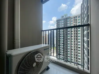 Modern balcony with city view and air conditioning unit in high-rise building.