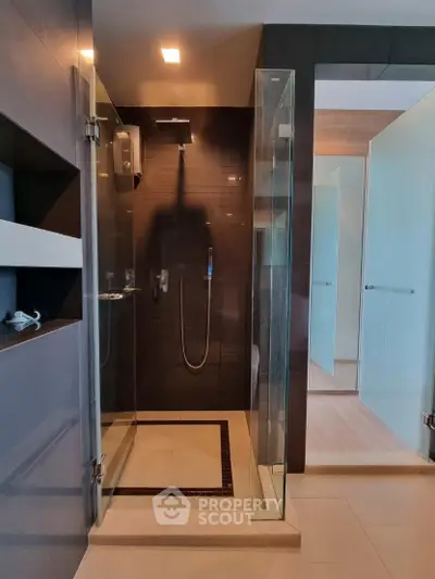 Modern bathroom with glass shower enclosure and sleek design