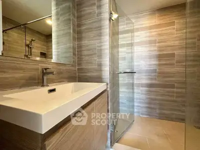 Modern bathroom with sleek design and glass shower enclosure