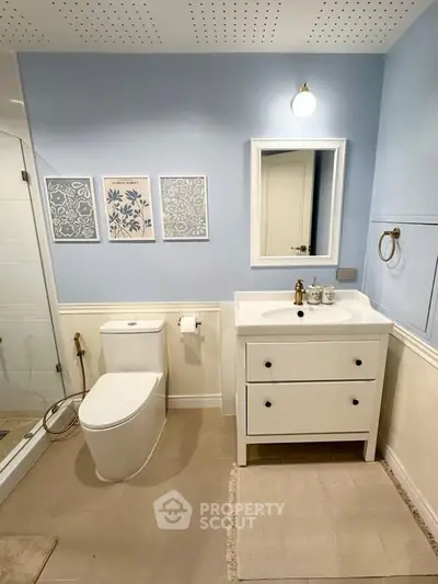 Charming bathroom with modern fixtures and elegant decor, perfect for a cozy home.