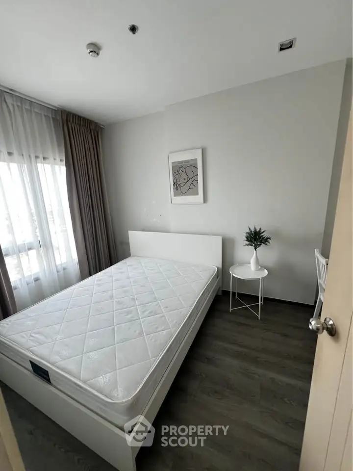 Modern minimalist bedroom with natural light and stylish decor