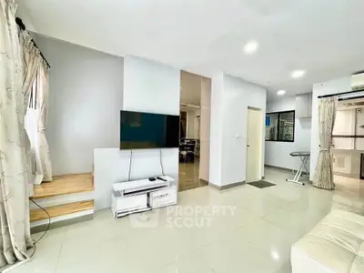 Spacious modern living room with TV and elegant decor