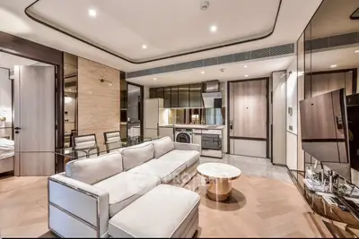 Luxurious modern living room with open kitchen and elegant decor