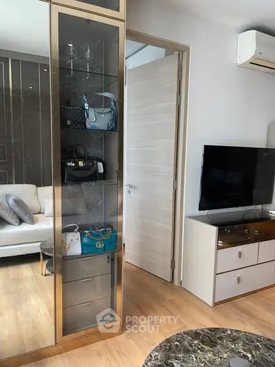 Stylish living room with modern decor and glass display cabinet