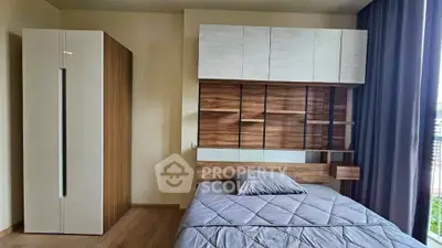 Modern bedroom with stylish wooden furniture and large window view