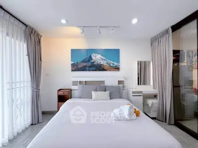 Modern bedroom with mountain artwork and elegant decor