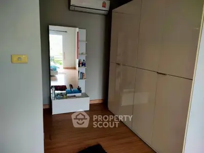 Stylish bedroom with sleek wardrobe and modern mirror design