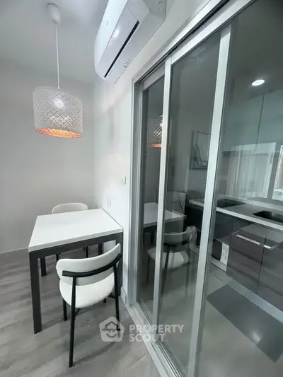 Modern kitchen with sliding glass doors and dining area