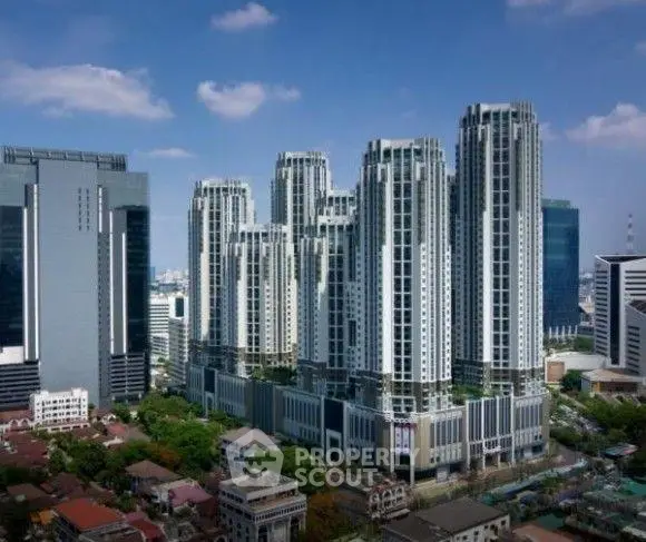 Stunning high-rise residential towers with modern architecture in a bustling urban setting.