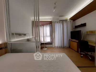 Modern bedroom with study area and natural light