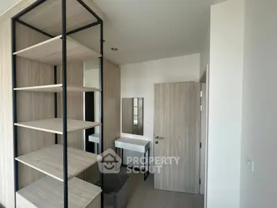 Modern minimalist bedroom with wooden shelves and vanity desk