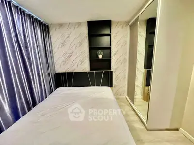 Modern bedroom with mirrored closet and stylish decor