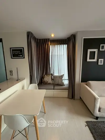 Modern living room with cozy seating and stylish decor in a contemporary apartment.