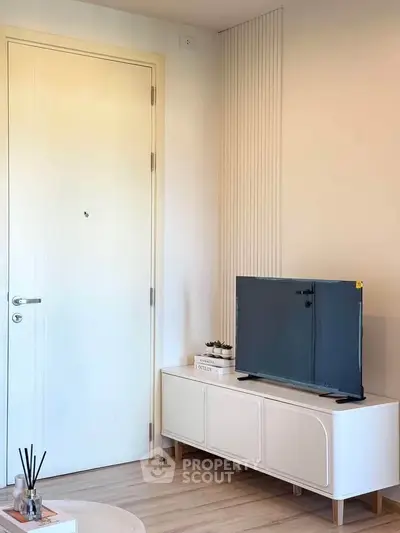 Modern living room with sleek TV stand and minimalist decor