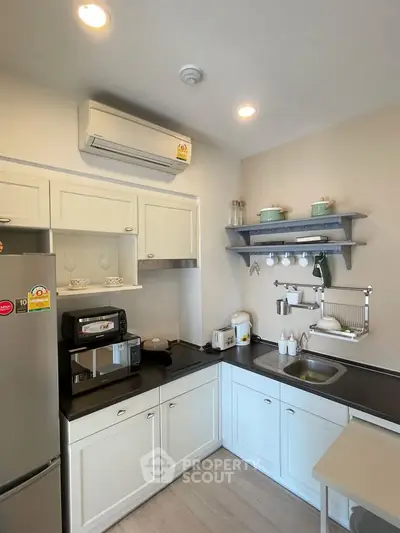Charming modern kitchen with sleek appliances and ample storage space