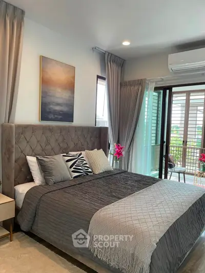 Luxurious bedroom with elegant decor and balcony access