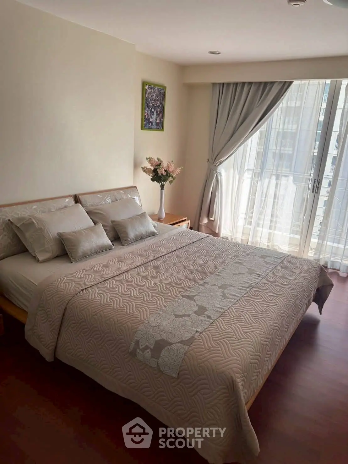 Elegant bedroom with large window and stylish decor