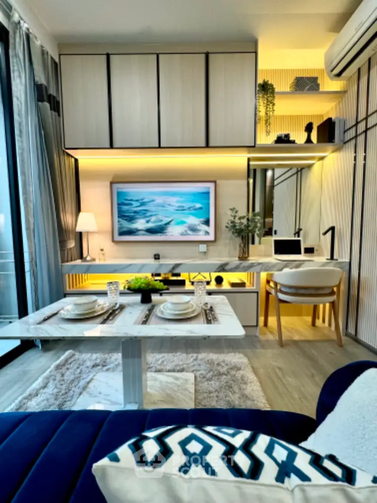 Modern living room with stylish decor and open layout, featuring a cozy dining area and sleek cabinetry.
