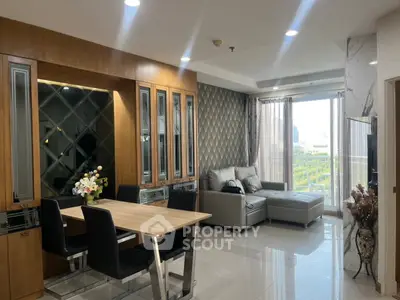 Modern living room with elegant dining area and large windows offering city views.