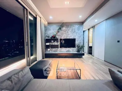 Luxurious modern living room with stylish decor and city view, perfect for urban living.
